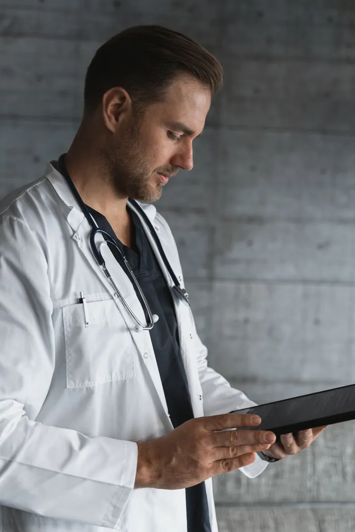 A qualified Australian doctor talking with a patient over a telehealth video call